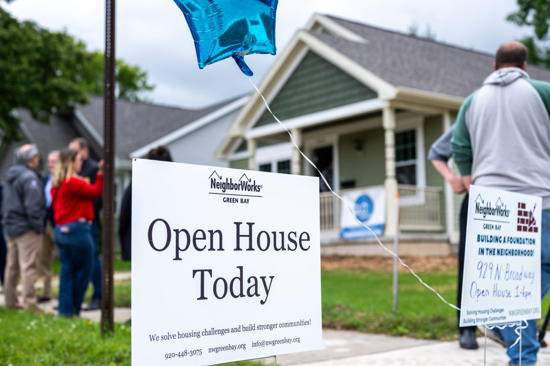 A sign reading 'Open House' is positioned outside the home at 929 N. Broadway in Green Bay, thanks to backing from the region's first Impact Investment.